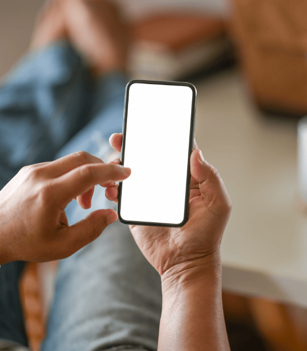 business-man-hand-holding-white-blank-mobile-phone-office (1)